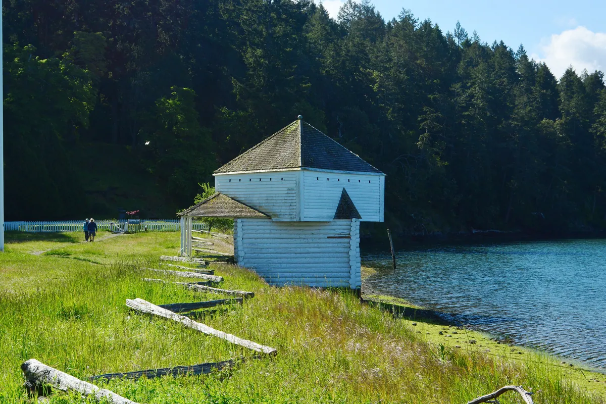The white wooden blockhouse at English Camp on the shore of Garrison Bay
