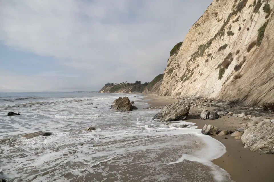 Hendry’s Beach with bluffs, sand and gentle surf in Santa Barbara