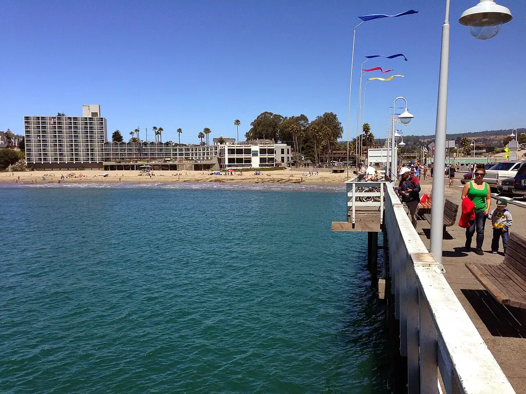 The Santa Cruz Wharf stretching over the beach toward the Boardwalk