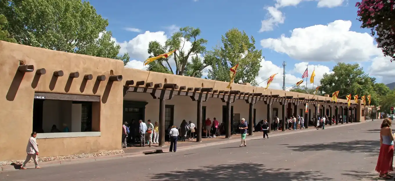 Santa Fe Plaza with the Palace of the Governors and adobe storefronts