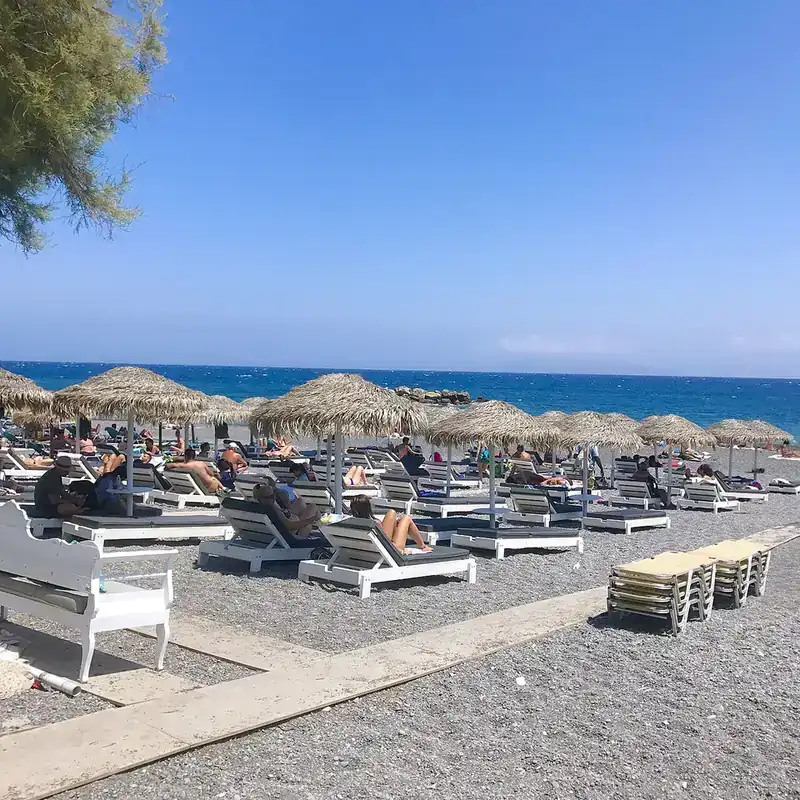 Kamari black sand beach