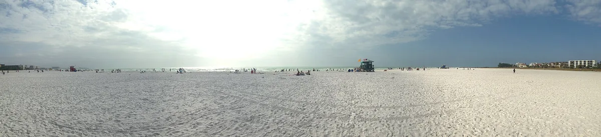 Siesta Beach panorama — the wide sweep of white quartz sand
