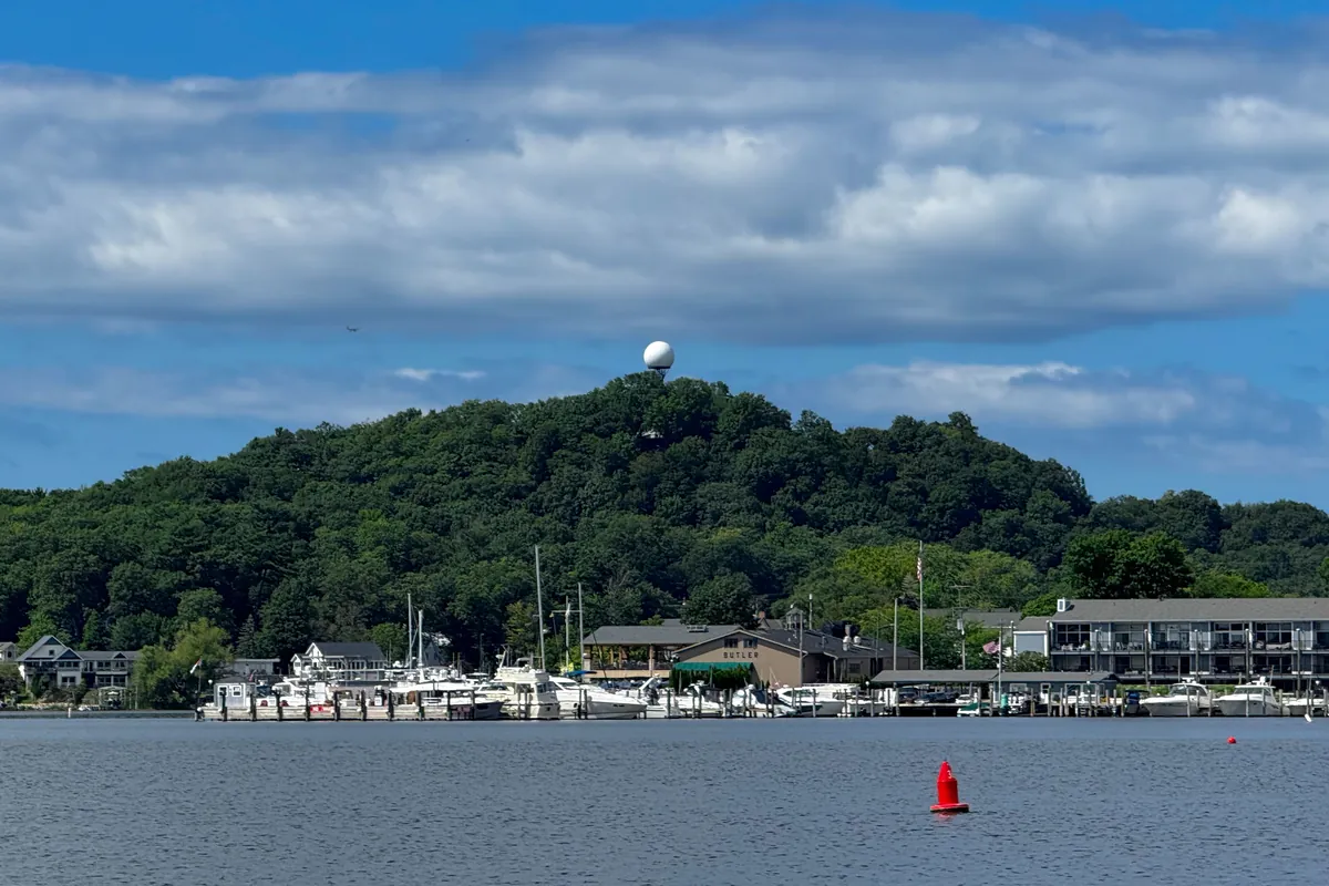 Mount Baldhead, a wooded sand dune rising above the river in Saugatuck