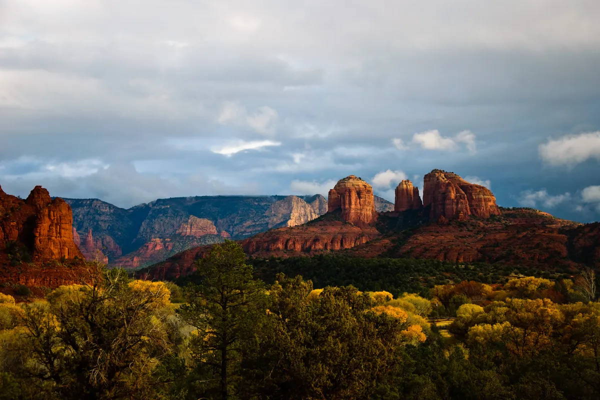 Red rock formations above autumn trees at Red Rock State Park, Arizona
