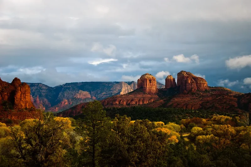 Red rock formations above the green trees of Red Rock State Park
