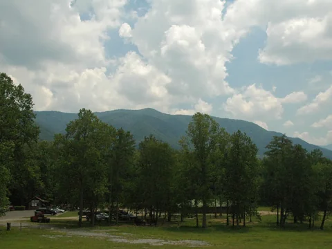 The wide green valley of Cades Cove ringed by forested ridges