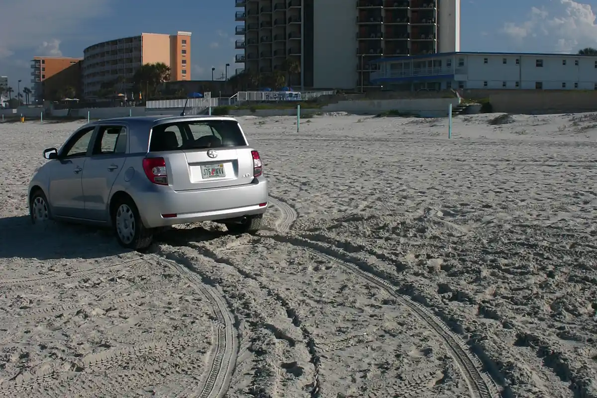 Car driving on the sand at Daytona Beach