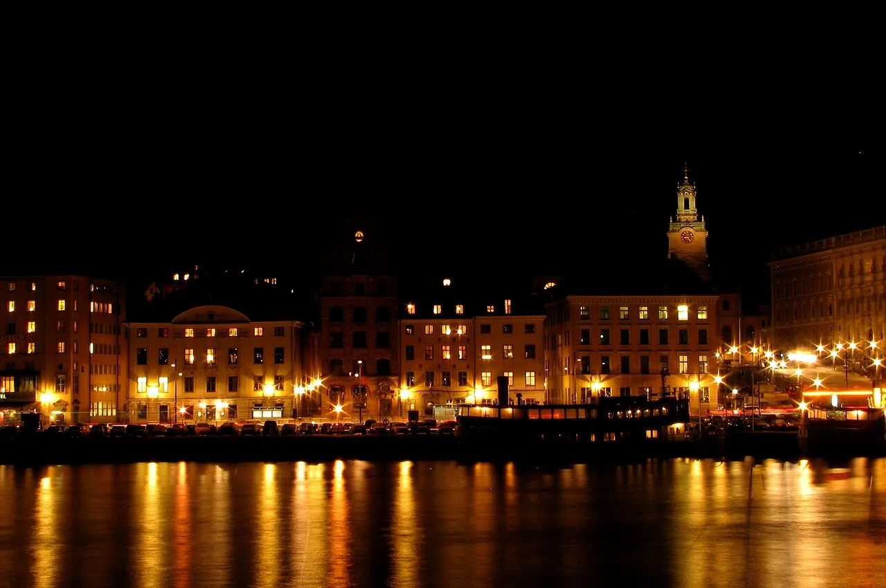 Gamla Stan waterfront glowing at night, Stockholm's old town