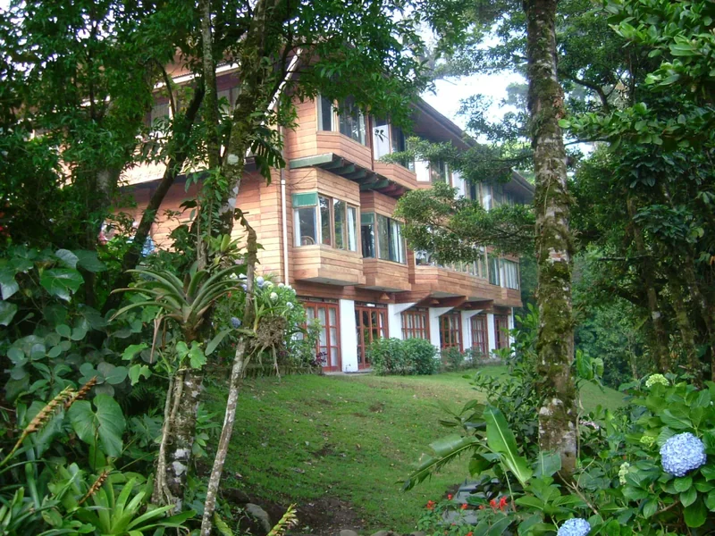 The Trapp Family Lodge seen through summer trees and gardens
