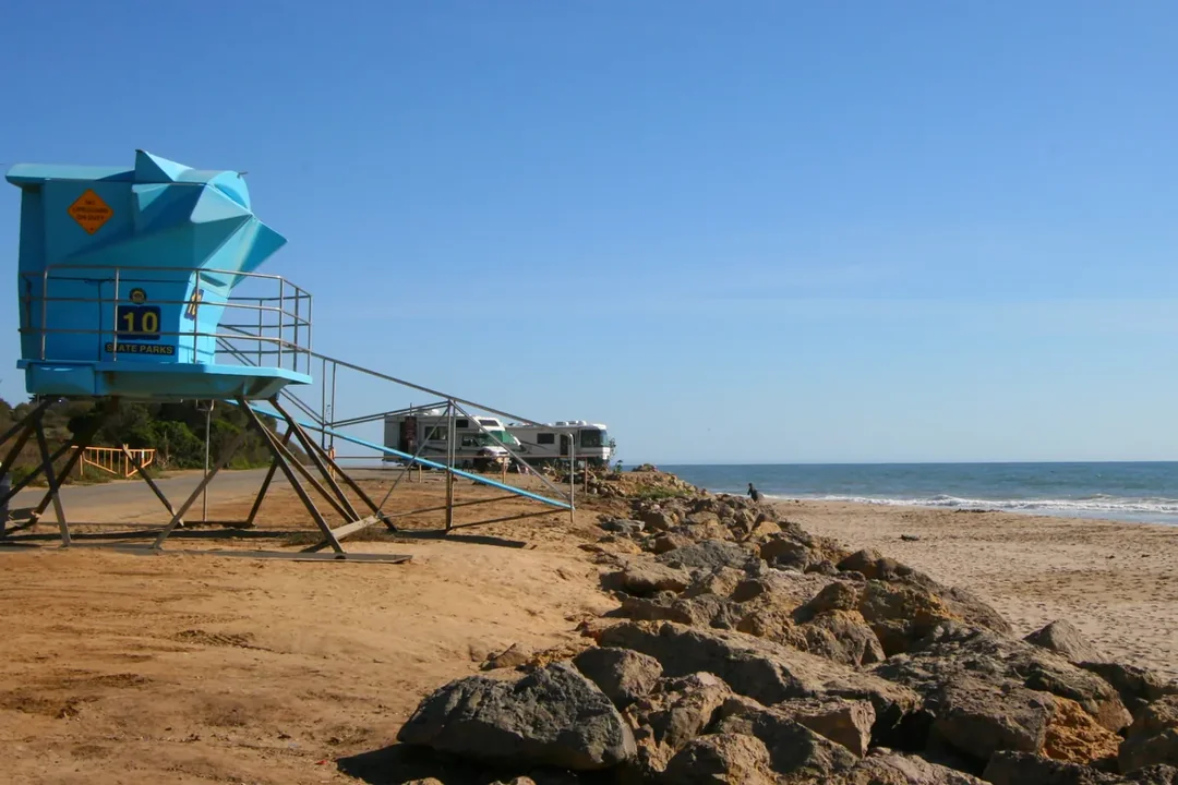 A lifeguard tower on the sand at Emma Wood State Beach with the ocean beyond