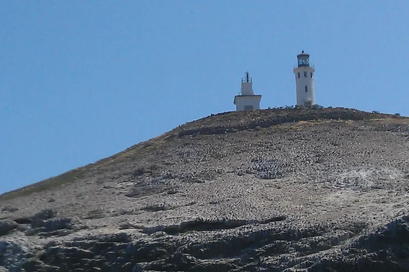 The Anacapa Island lighthouse on its cliff-top above the ocean
