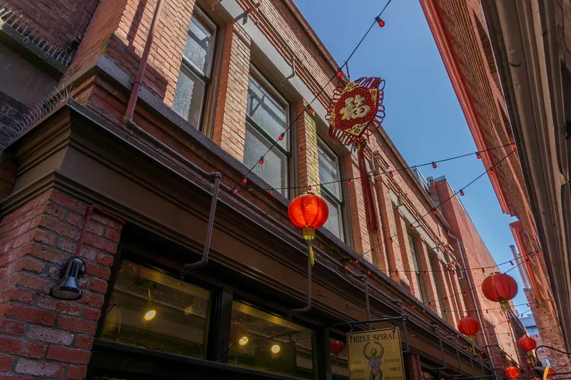 Fan Tan Alley, a narrow lane between brick buildings in Victoria’s Chinatown