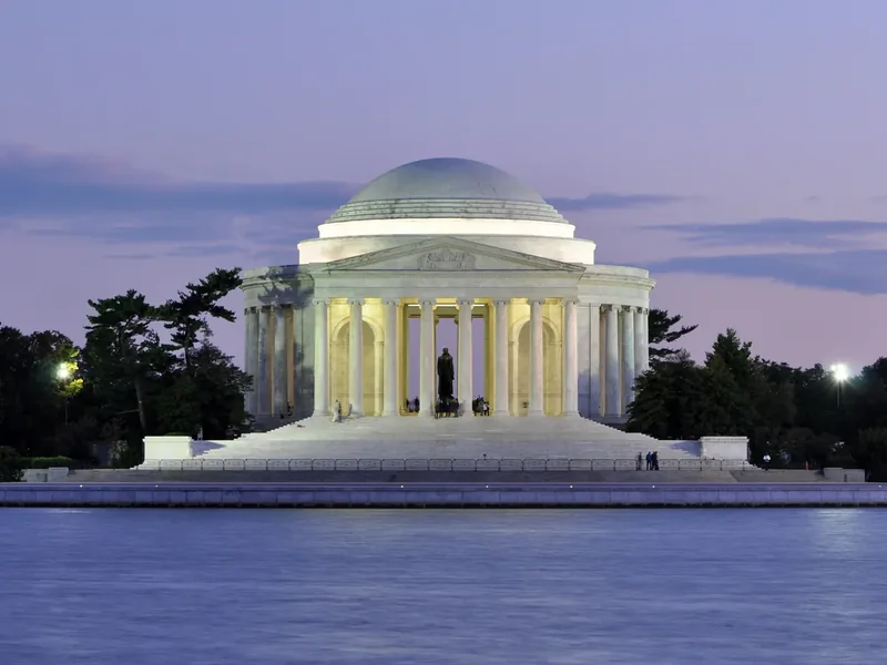 The Jefferson Memorial lit at dusk across the Tidal Basin