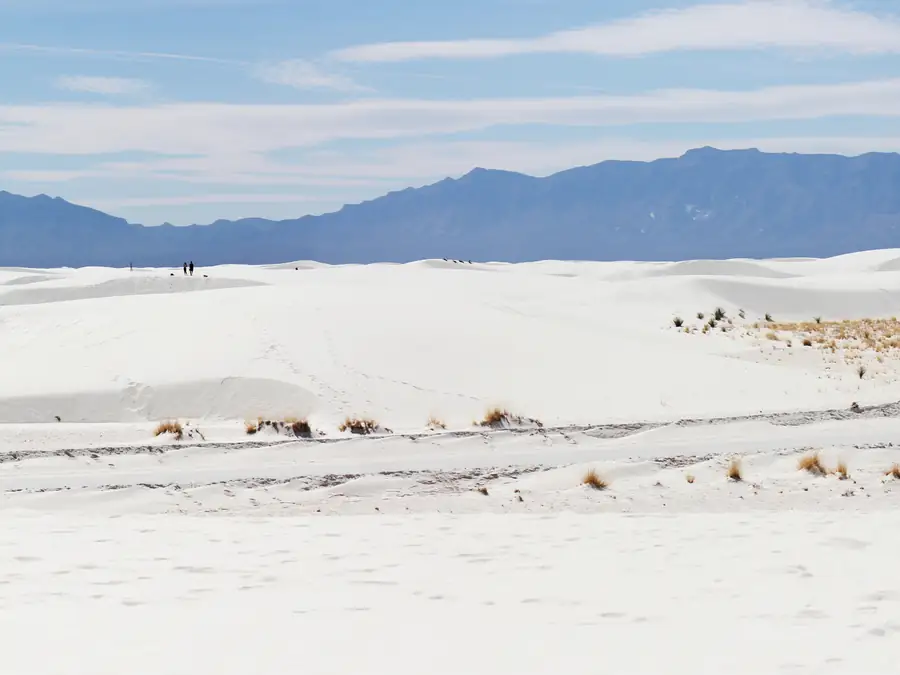 White dunes with mountains behind